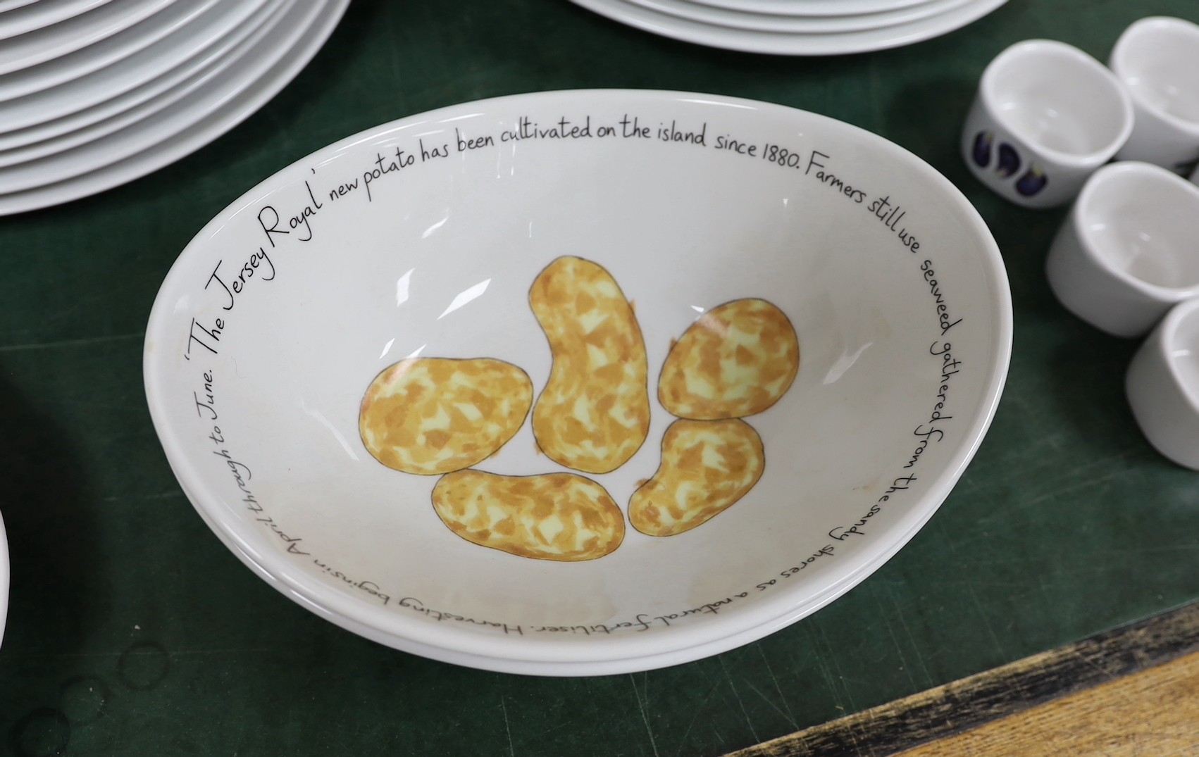 An extensive Richard Bramble for Jersey Pottery dinner service, decorated with fish, cheese etc.